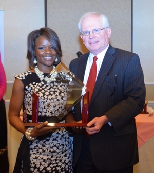 sam-johnson-and-client-receiving-award | Nicholson Revell Augusta GA Attorneys